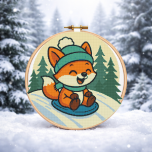 A cat slides down a snowy hill in winter - Cross stitch pattern PDF